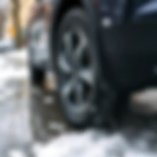 A close-up of all-season tires on a 2019 CR-V EX parked on a wet street during a light snow, highlighting tire tread for better grip in varied weather conditions