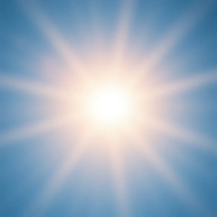 A bright sun shining with rays extending outward against a clear blue sky.
