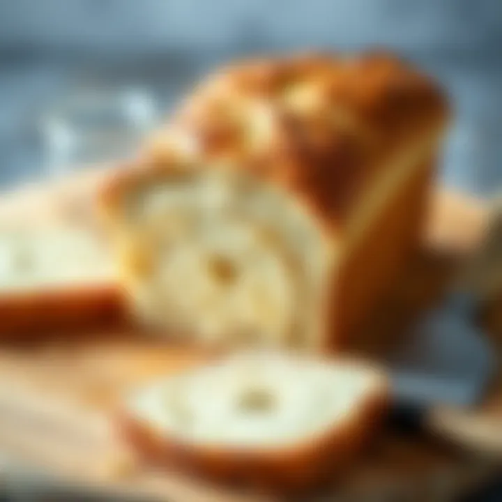 Freshly baked homemade bread loaf on a wooden cutting board, with a golden crust and soft texture, surrounded by a few slices