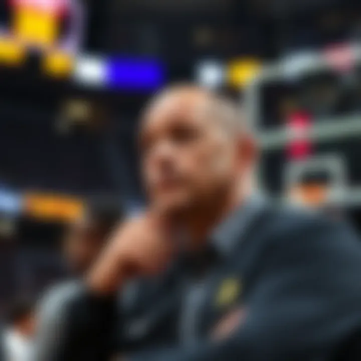 An NBA coach reflects on missed investment in Bitcoin, looking thoughtful in a basketball setting.