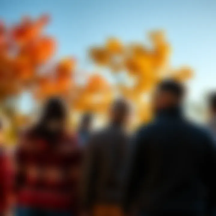 A group of Texans wearing sweaters and enjoying the cool autumn breeze under colorful trees
